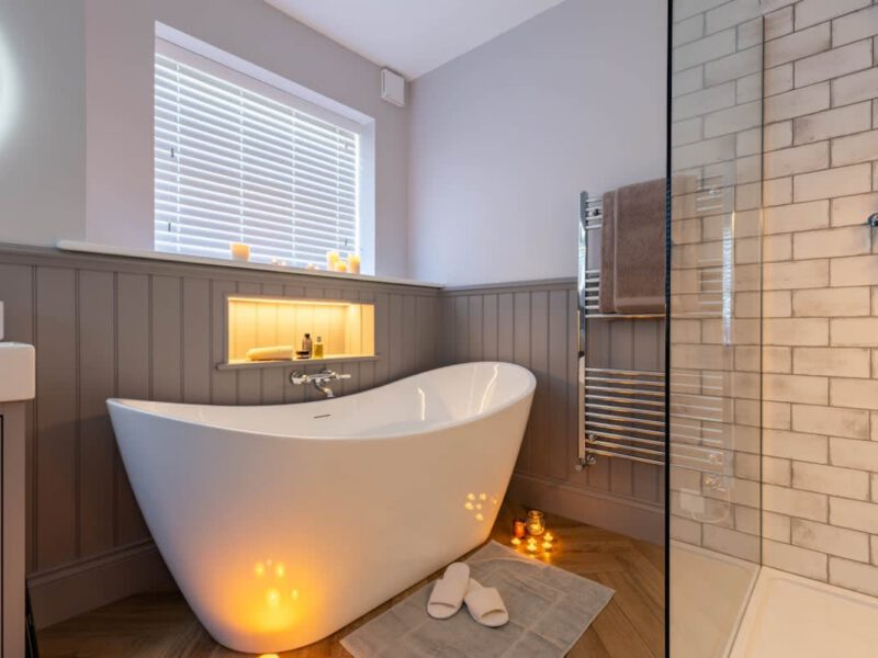 Luxurious bathroom with freestanding tub and shower at Castle View Cottage.
