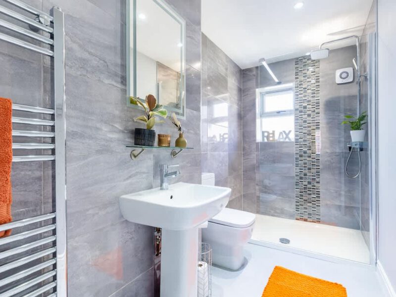 Modern bathroom with walk-in shower at Townhouse Harbour Retreat.