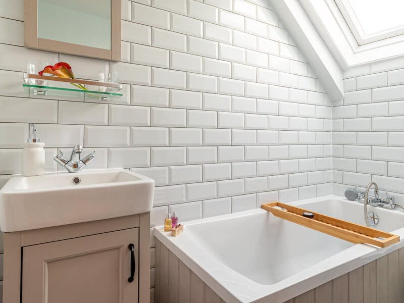 Modern bathroom with subway tiles at dog-friendly Garth Cottage.