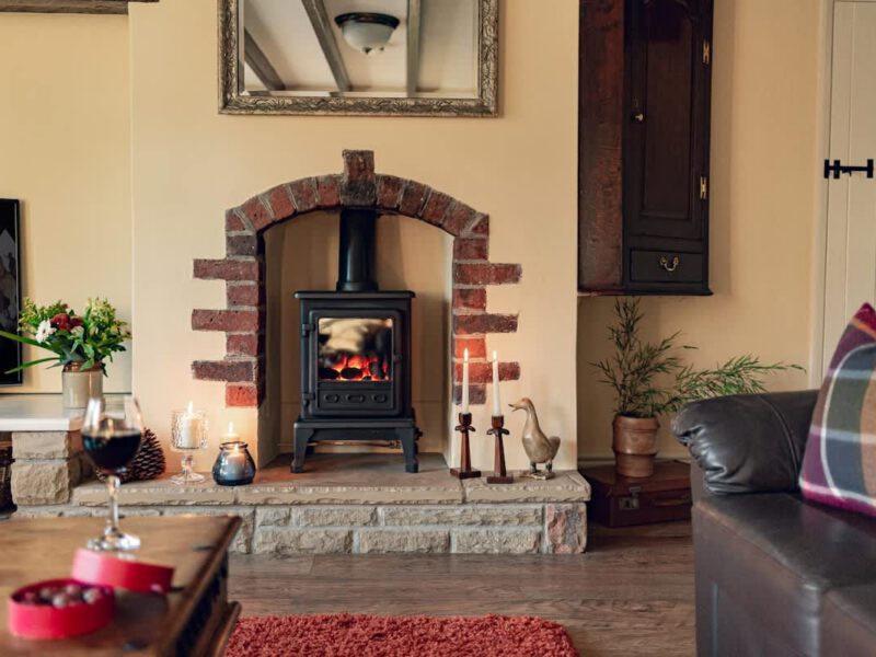 Cozy fireplace with wood burner at dog-friendly Garth Cottage, sleeps 4.