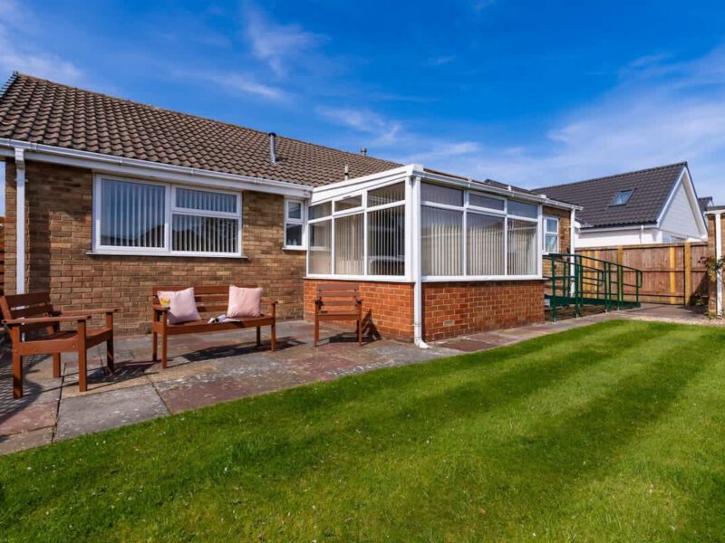 Garden seating and conservatory at Coastal Village Hideaway holiday let.
