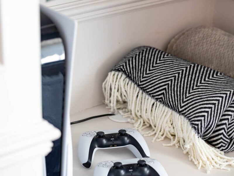PlayStation controllers and console at Castle View Cottage, a holiday let.