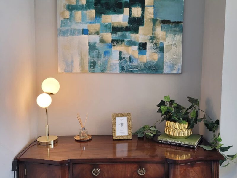 Crescent View: modern art and decor on a vintage sideboard.