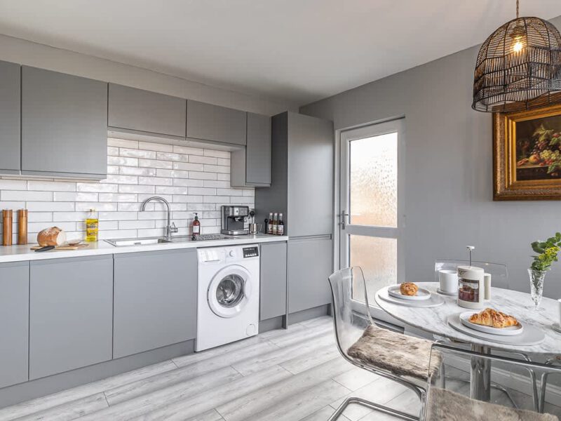 Modern kitchen with dining area at Crescent View holiday let.