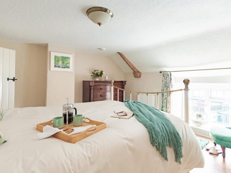 Cozy bedroom with coffee tray at dog-friendly Garth Cottage, sleeps 4.