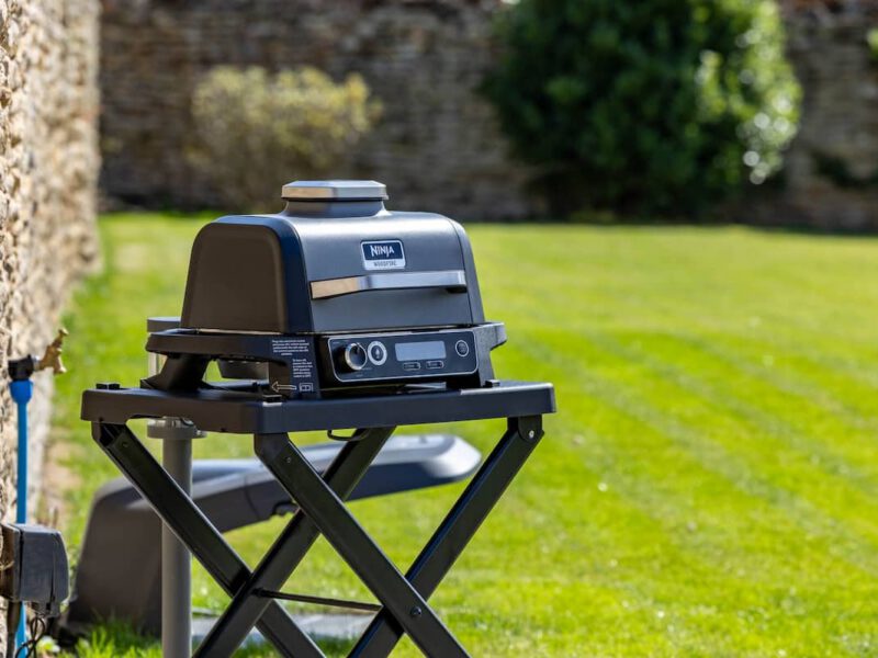 Ninja Woodfire grill on stand at Castle View Cottage, ideal for outdoor cooking.