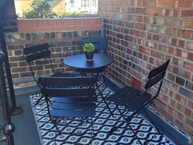 Crescent View balcony with seating and town views, sleeps 4.