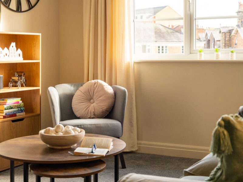 Cozy reading nook in the Penthouse Suite, a quiet central escape.
