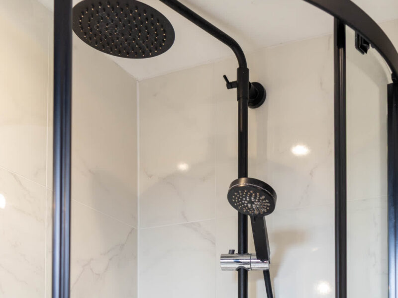 Modern black shower with rainfall head in Ocean Pearl holiday let.