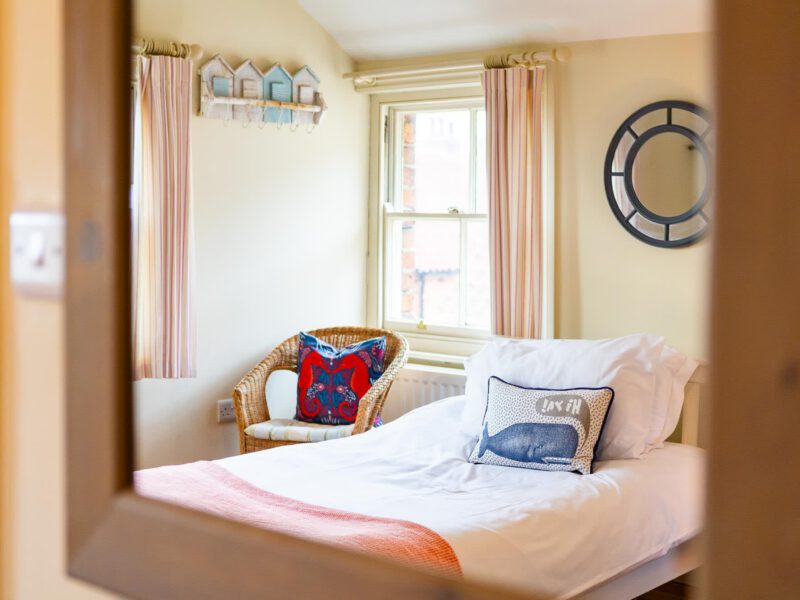 Coastal bedroom with sea-themed decor at Harbour View House.