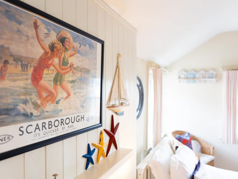 Vintage Scarborough poster and nautical decor at Harbour View House.