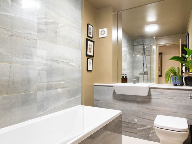 Modern bathroom with bathtub and sink at Old Town House holiday let.