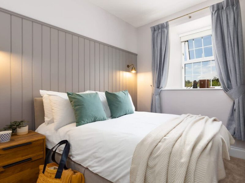 Comfortable bedroom at Castle View Cottage with ensuite hot tub and EV charger.
