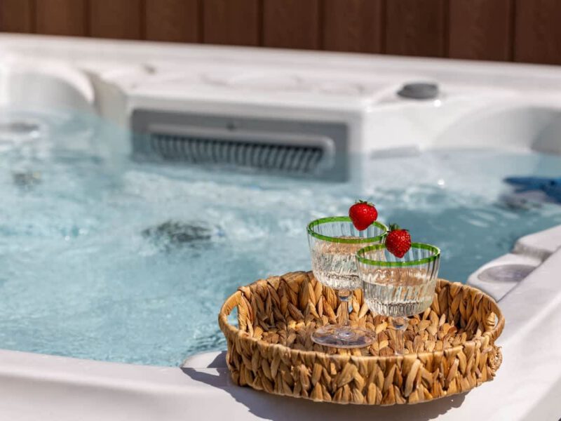 Relaxing hot tub with drinks and strawberries at Castle View Cottage.