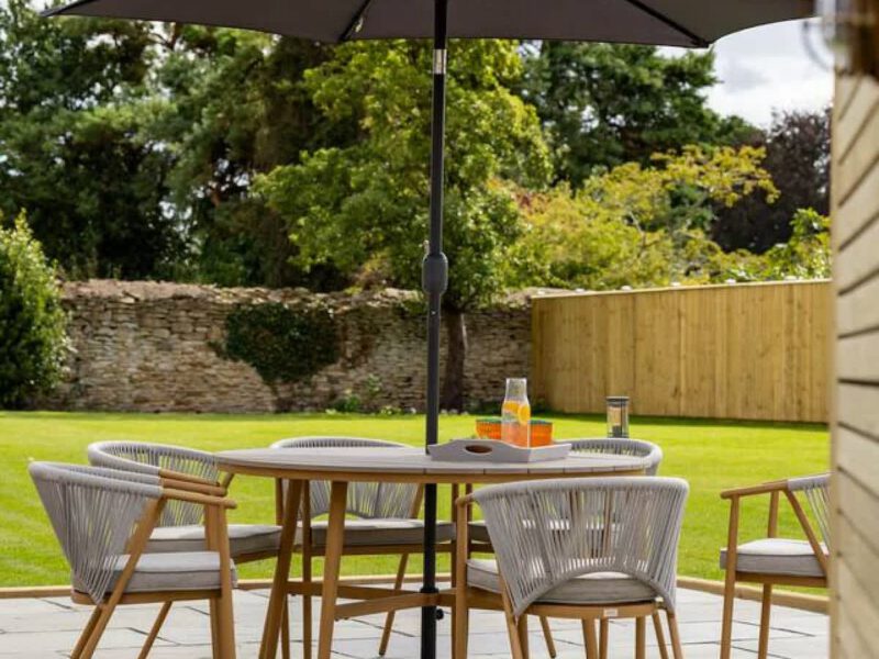 Outdoor dining set with umbrella at Castle View Cottage.