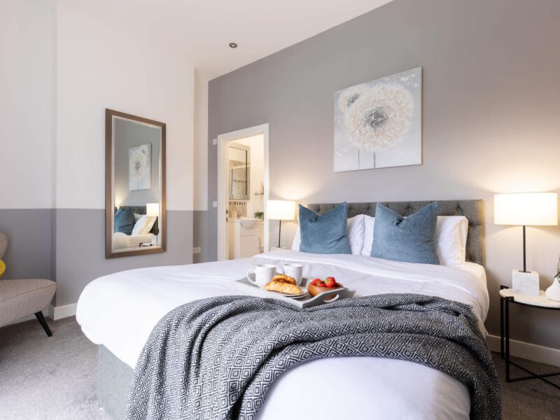 Comfortable bedroom with breakfast tray at Welton View Escape holiday let.