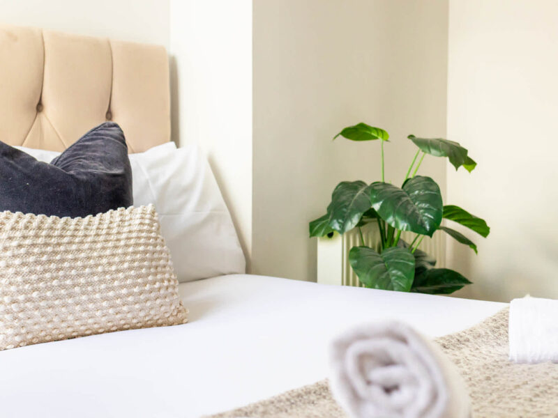 Comfortable bedroom with plush pillows at Ocean Pearl holiday let.