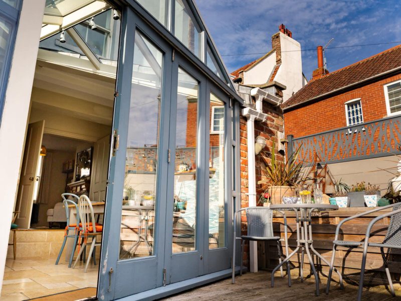 Conservatory and patio seating at Harbour View House, Old Town.