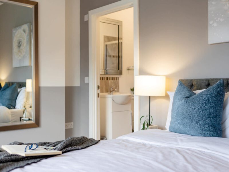 Comfortable bedroom with ensuite bathroom at Welton View Escape holiday let.