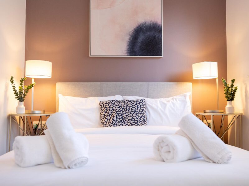 Comfortable bedroom with plush towels at Welton View Escape holiday let.