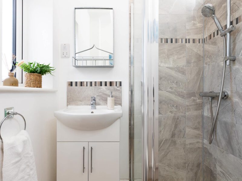 Modern bathroom with shower and sink at Welton View Escape holiday let.
