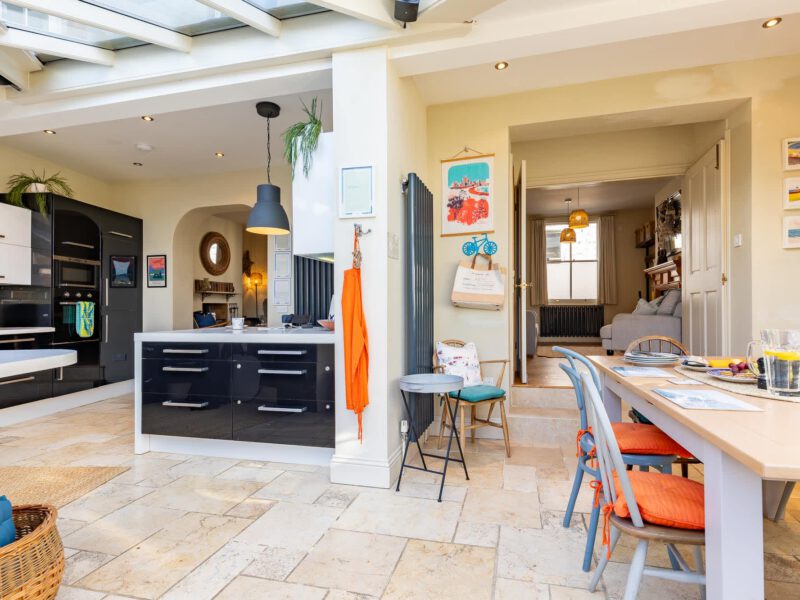Modern kitchen and dining area with sea views at Harbour View House.