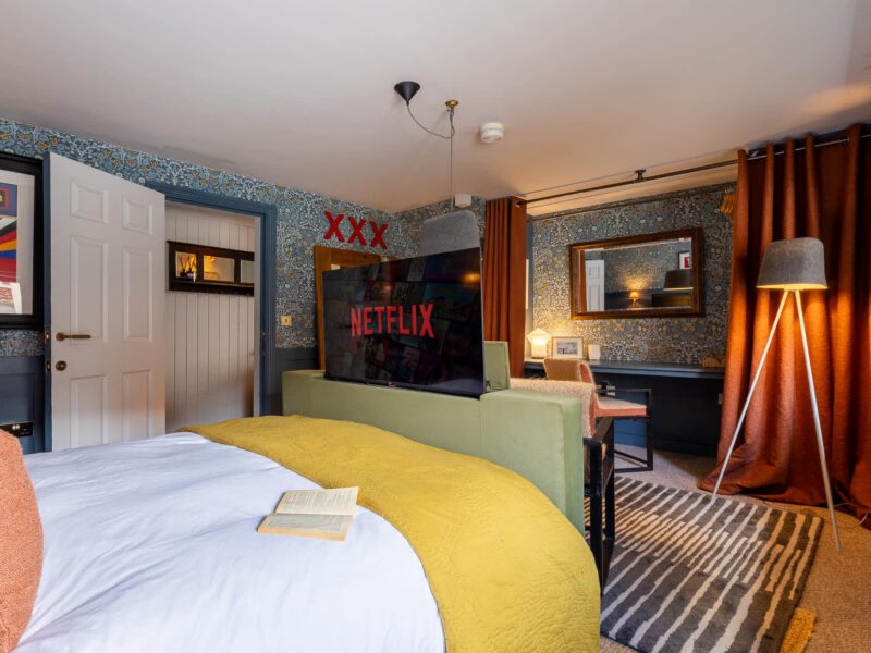 Stylish bedroom with Netflix TV at The Loft by the Bay holiday let.
