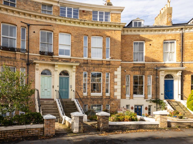 Penthouse Suite exterior with steps and colourful doors on Royal Crescent.