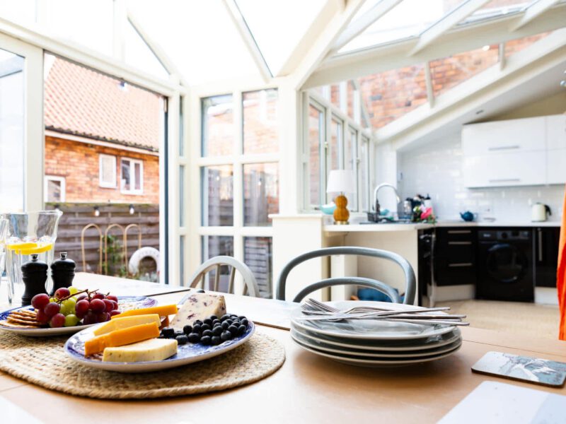 Dining area with cheese board and fruit at Harbour View House.