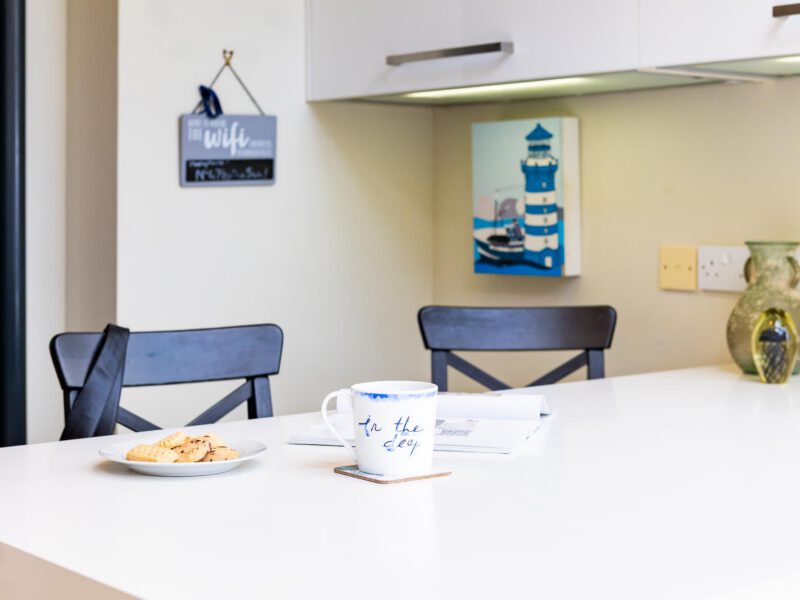 Coastal decor and a mug at Harbour View House, perfect for your holiday let stay.