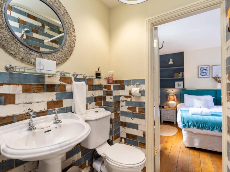 Stylish bathroom and bedroom at Harbour View House with sea views.