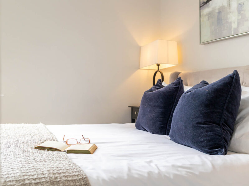 Comfortable bedroom with plush pillows at Ocean Pearl holiday let.