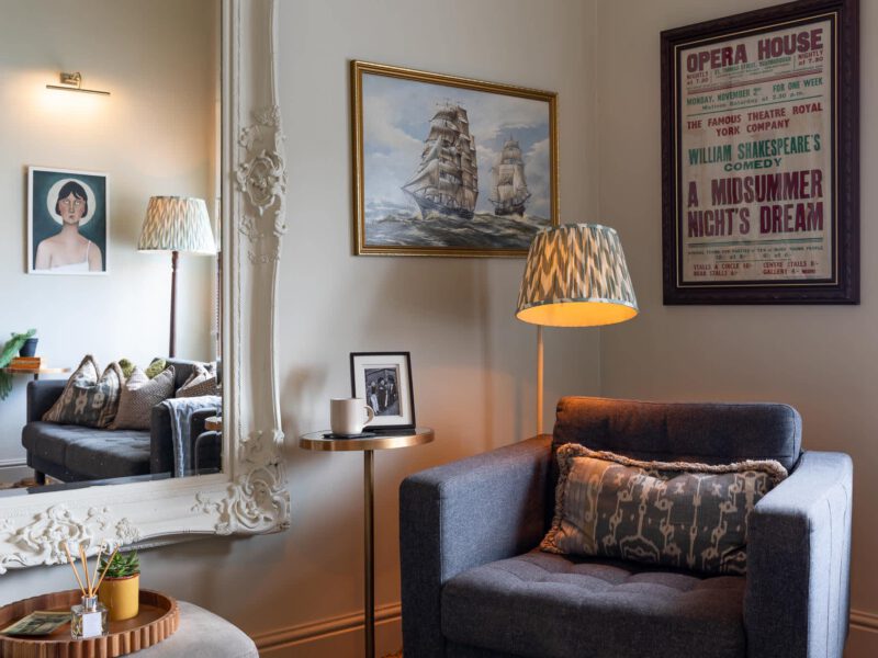 Stylish living area with nautical art at The Loft by the Bay holiday let.