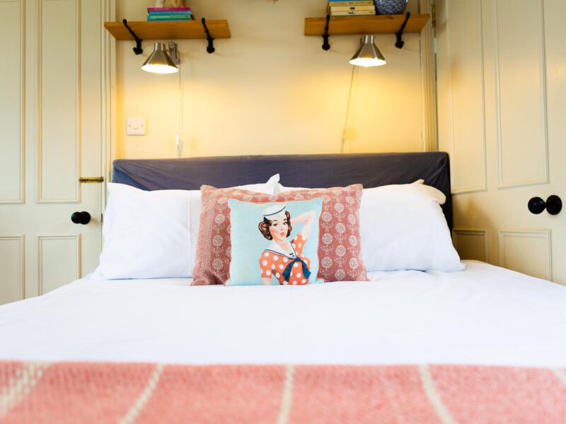 Comfortable double bedroom with nautical-themed decor at Harbour View House.