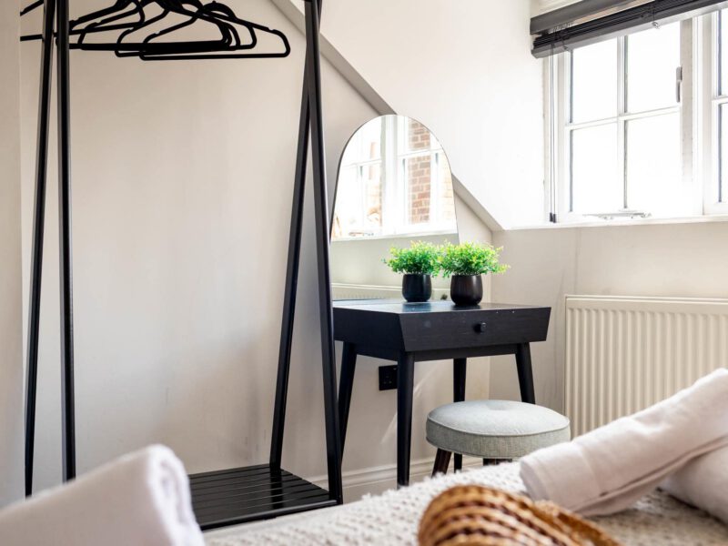 Dressing table with mirror and plants at Ocean Pearl holiday let.