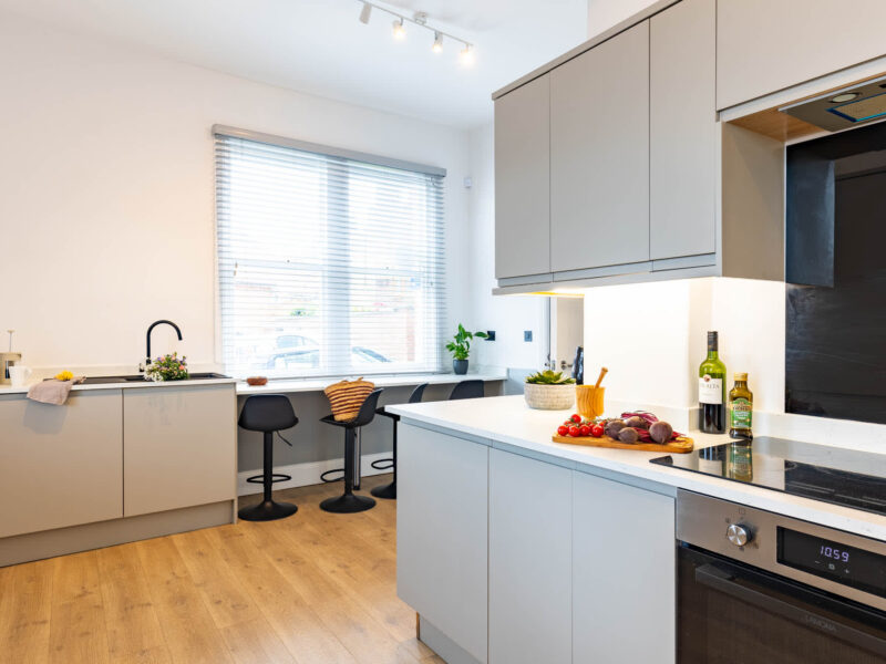 Modern kitchen with breakfast bar at Ocean Pearl holiday let.