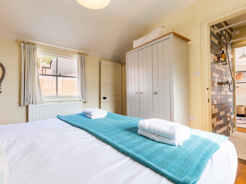 Bedroom with ensuite shower room at Harbour View House, Old Town.