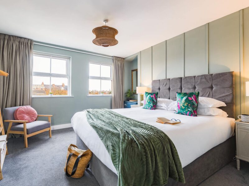 Penthouse Suite bedroom with king-size bed and city views.
