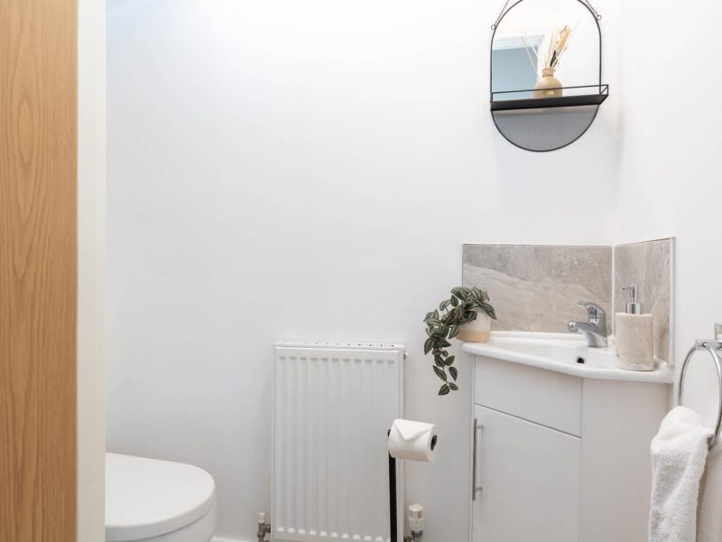 Modern bathroom with sink and toilet at Welton View Escape holiday let.