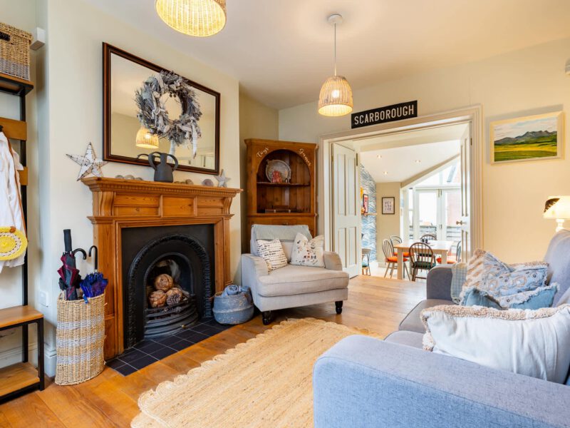 Cosy living room with fireplace and sea views at Harbour View House, Scarborough.