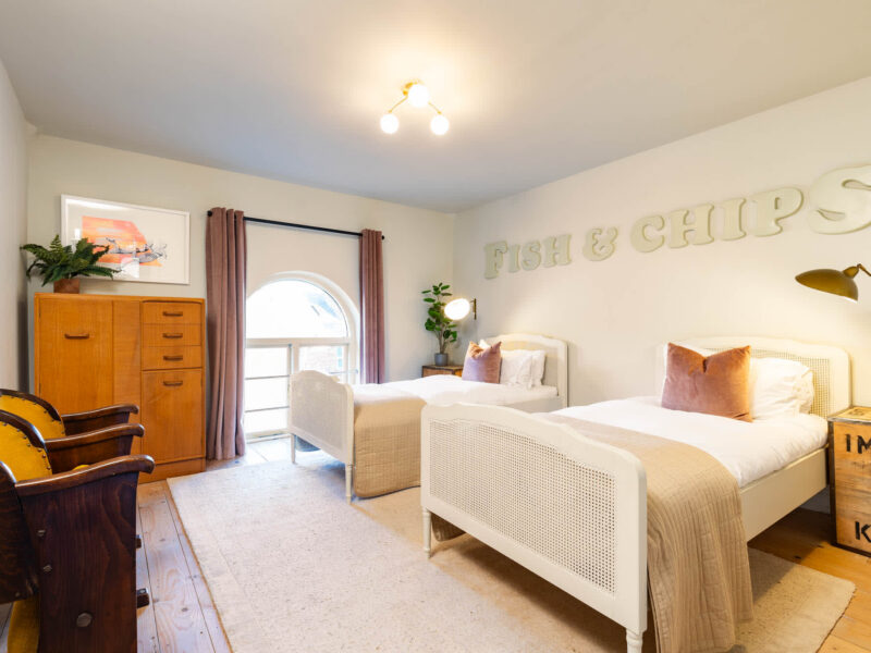 Twin beds in Old Town House, a dog-friendly converted church holiday let.