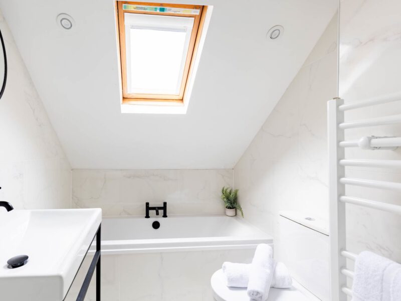 Modern bathroom with skylight at Ocean Pearl holiday let.