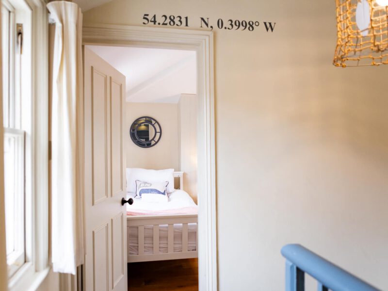 Bedroom with nautical decor at Harbour View House, Old Town.