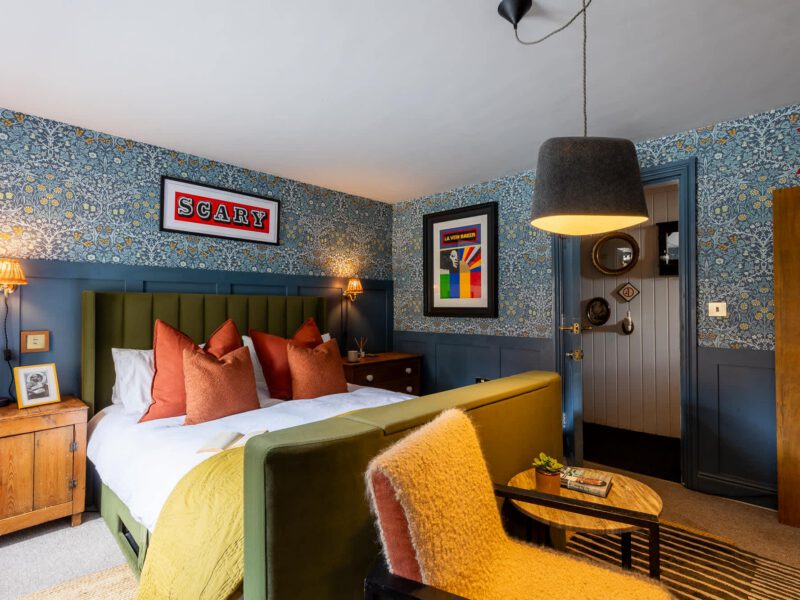 Stylish bedroom at The Loft by the Bay, a dog-friendly holiday let.