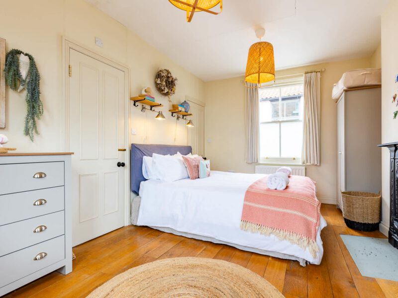 Comfortable bedroom with sea views at Harbour View House, Old Town.
