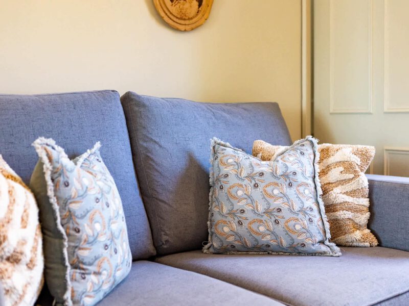Comfortable sofa with decorative cushions at Harbour View House holiday let.