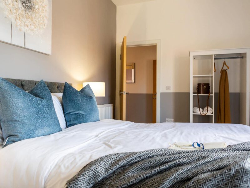 Comfortable bedroom with coastal decor at Welton View Escape holiday let.