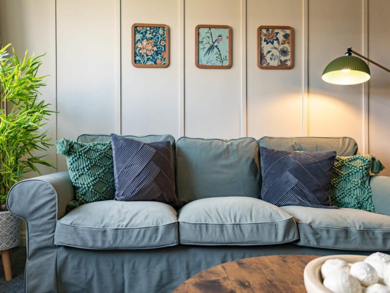 Penthouse Suite living area with decorative art and comfortable sofa.
