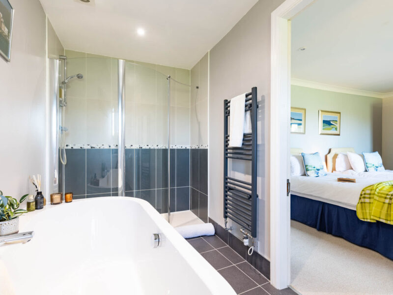 Modern bathroom and bedroom at East Wing holiday let.