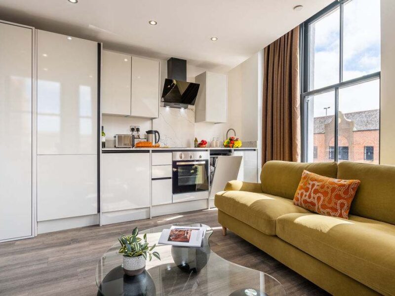 Modern kitchen and living area in Albemarle Chambers, a central retreat for two.